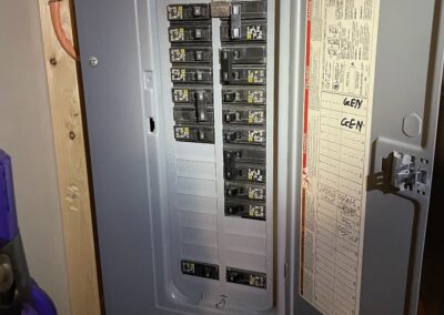 A grey electrical box with many switches.